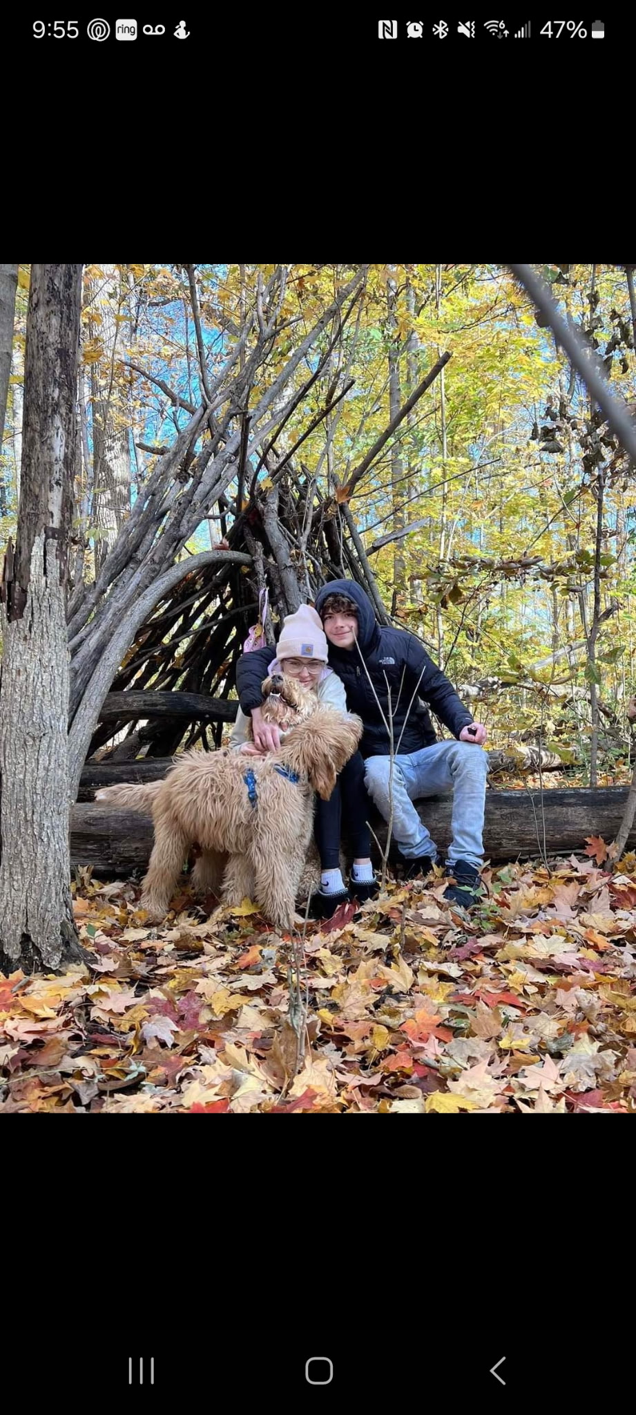 Drake, Jayme, and their dog outdoors